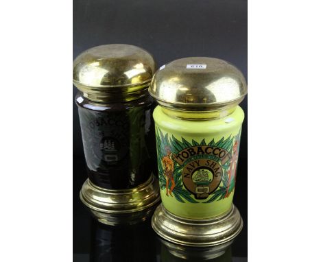 Two contemporary ceramic tobacco jars raised on metal supports and lids..