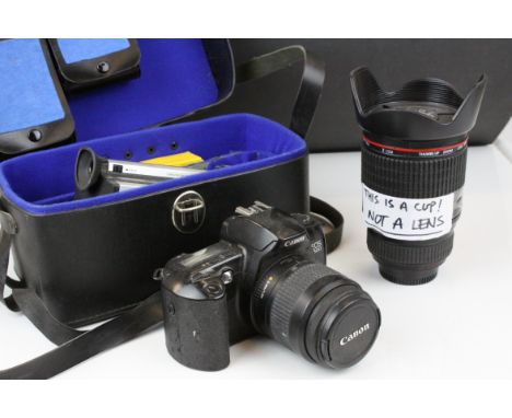 Canon auto 200m 318m camera, canon E05 500 camera and a Cup in the form of a Lens