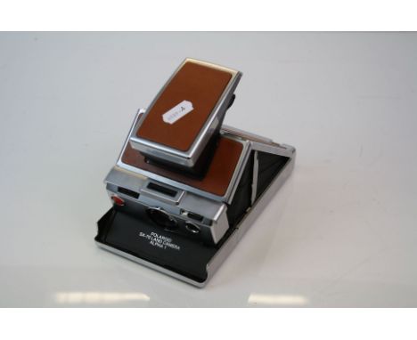 A vintage Polaroid SX-70 Land Camera Alpha 1.