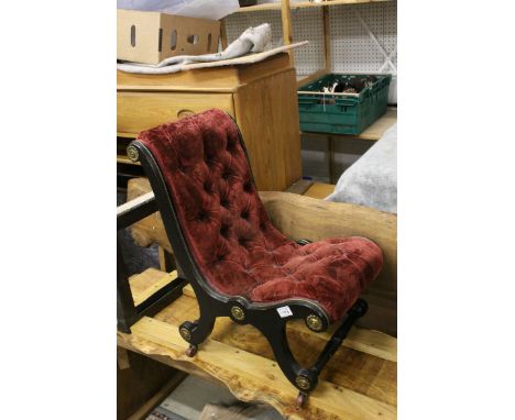 Victorian Nursing Chair with Ebonised Scroll End Frame and Button Back Upholstery, raised on castors, 68cms high