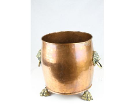 Large Copper Planter / Log Basket with Brass Lion Mask Ring Handles and raised on Three Brass Lion Paw Feet, 37cms high