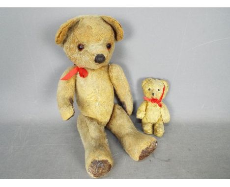 Teddy Bears - Two unboxed and unmarked vintage teddy bears. Lot includes a fully jointed golden mohair bear measuring approxi