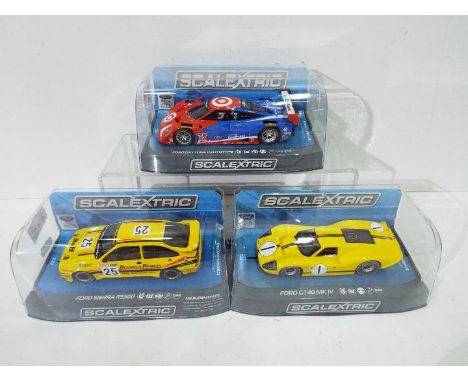 Scalextric - three 1:32 scale Scalextric cars comprising Ford GT40 MK IV #C3859. Ford Sierra RS500 #C3868 and Ford Daytona Pr