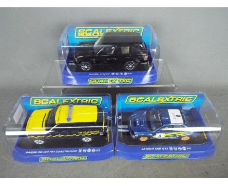 Scalextric - three 1;32 scale Scalextric cars comprising Jaguar XKR GT3 #C3144, Range Rover HM Coastguard #C2877 and black Ra