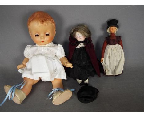 A collection of three unboxed vintage dolls. Lot includes a doll marked 'BND London' to rear of head with closed mouth, sleep
