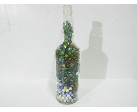 Marbles - A large glass half gallon King John Scotch Whisky bottle full of vintage marbles in Good condition.