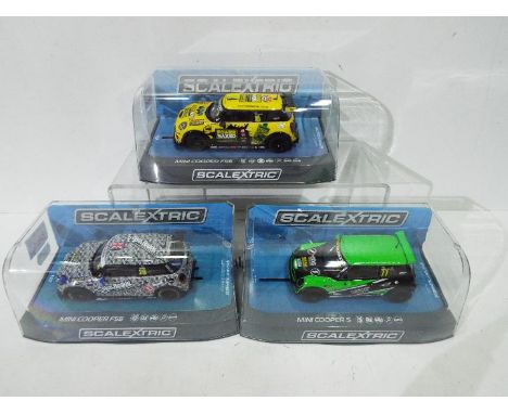 Scalextric - three 1:32 scale Scalextric cars comprising Mini Cooper #C3743, Mini Cooper F56 #C3873 and Mini Cooper F56 #C374