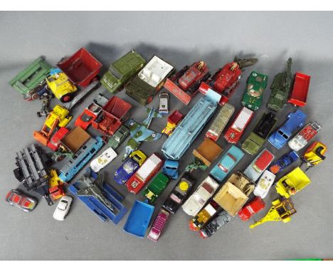 Matchbox, Dinky Toys, Corgi Toys, Britains, Others - A collection of unboxed and playworn diecast vehicles in several scales.