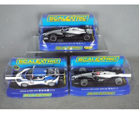 Scalextric -  Three boxed Scalextric slot cars. Lot includes Scalextric C3599 Lous Evora GT4 Kershaw / Yousef RN77; C3665 McL