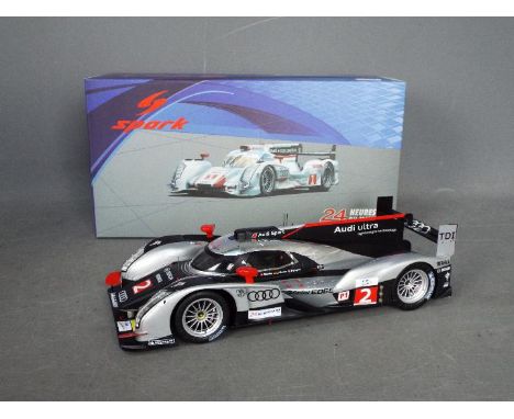 Spark - An Audi R8 etron Le Mans car in 1:18 scale # 18LM12. The car is Near Mint but there is a broken plastic aerial which 