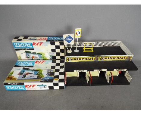 Scalextric, Triang, Herpa - Two boxed vintage Scalextric buildings plastic model kits and an unboxed built Herpa #903 Pit Gar