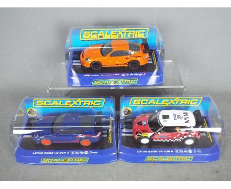 Scalextric -  Three boxed Scalextric slot cars in unassociated boxes. Lot includes Scalextric Porsche GT3 RS (x2 blue, and or