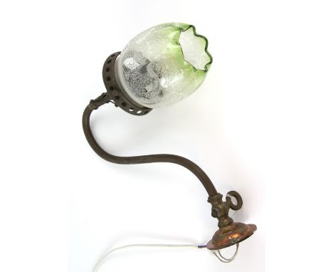 An early 20th century copper and brass wall light converted from a gas lamp, with etched green and clear glass shade, extends