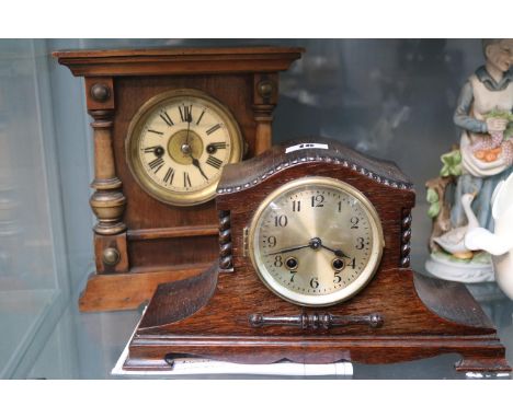 Two mantel clocks to include 1920s oak cased clock and Victorian roman numeral dialled clock with pillared decoration. 
