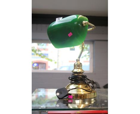 Antique style brass bankers lamp with green glass shade. 