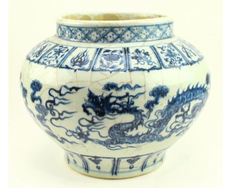 A large Chinese blue and white "Dragon &amp; clouds" porcelain jar. The squat baluster-shaped body is painted in a strong ton