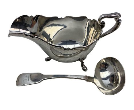 Elizabeth II silver sauceboat, W. Greenwood & Sons, Sheffield, 1957 and a Victorian silver fiddle pattern sauce ladle, John S