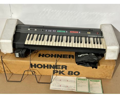 A Hohner PK80 keyboard, with box and accessories.