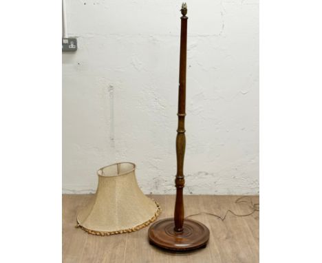 A vintage standard lamp with shade.