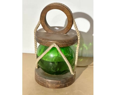 A ships lantern style table lamp, with green glass shade. 20x20x35cm