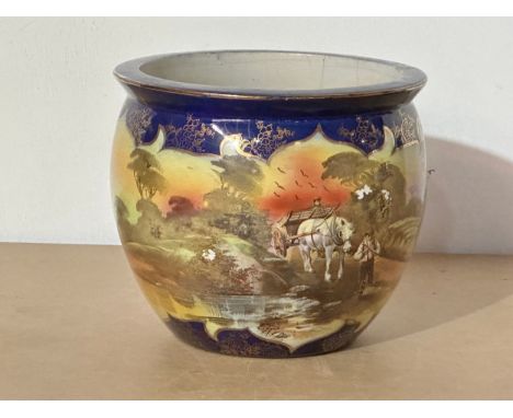 A signed early 20th century jardiniere/planter. Tudor, England. Signed L. Reid. 20x17cm