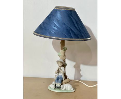 A NAO pottery table lamp. 47cm