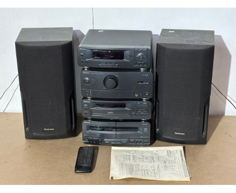 A Technics music system. Tuner/Sound Processor ST-CH510. Stereo Amplifier SE-CH510. Compact Disc Player SL-CH510. Stereo Cass