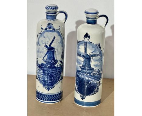 A pair of Dutch delft blue and white bottles. Zenith. Bols. 29cm