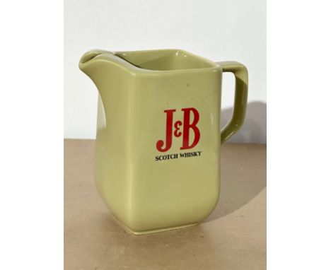 A J&amp;B Scotch Whisky jug. By Wade. 16x9x15.5cm.