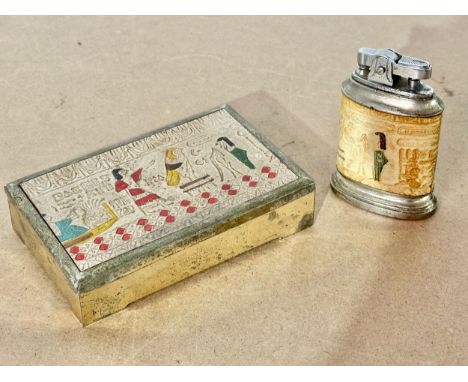 A vintage Egyptian style cigarette case with matching table lighter.
