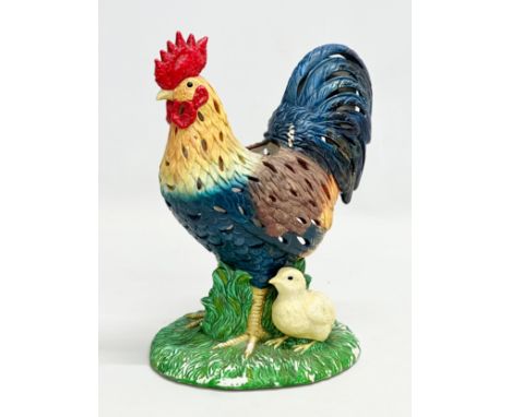 A pottery rooster tea light. 20x26cm
