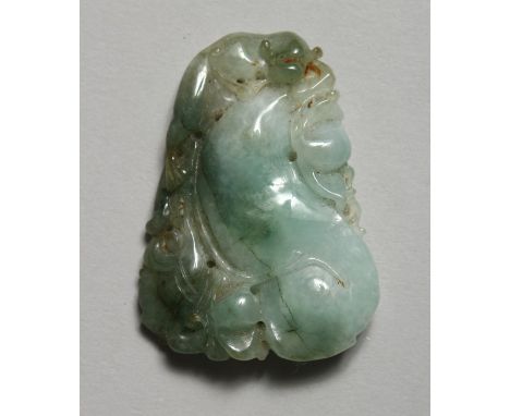 A CHINESE CARVED JADE PENDANT 2ins x 1.25ins.