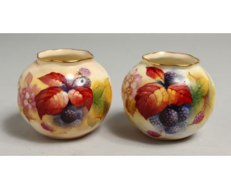 A PAIR OF ROYAL WORCESTER VASES painted with autumnal leaves and berries by Kitty Blae. Signed K. Blake, shape G161, differin