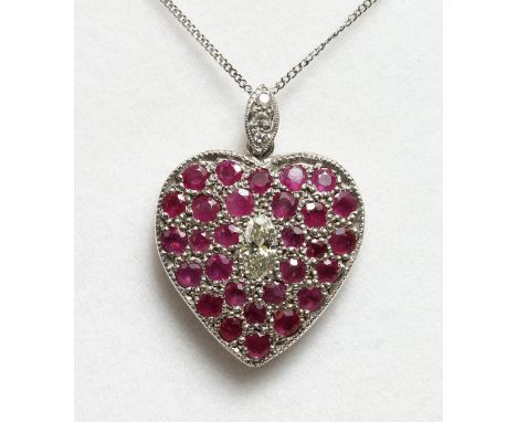 A RUBY AND DIAMOND HEART SHAPED PENDANT AND CHAIN.