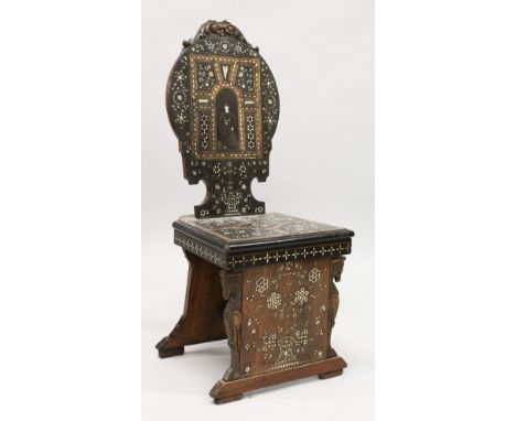 AN UNUSUAL LATE 19TH CENTURY ITALIAN RENAISSANCE WALNUT HALL CHAIR, the shaped back panel with carved c resting, inlaid with 