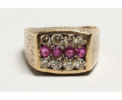 A 9CT GOLD THREE ROW DIAMOND AND RUBY RING