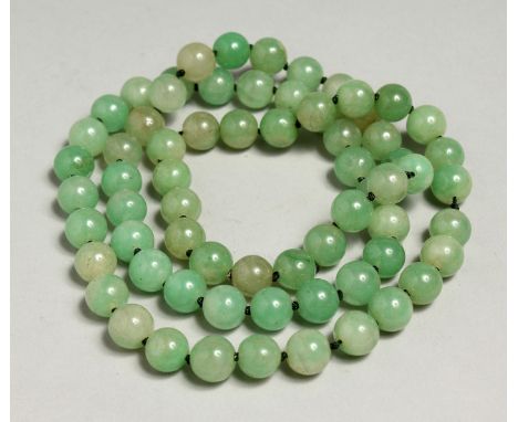 A STRING OF JADE BEADS