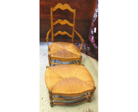OPEN ARMCHAIR, French provincial stained and line painted fruitwood with ladder back, rush seat and footstool to match, 65cm 