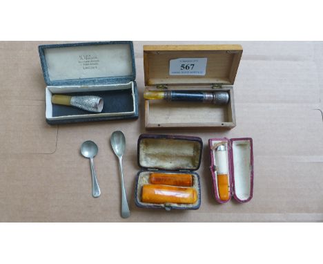 Magpie lot of amber and silver and silver plated cigarette and cigar holders