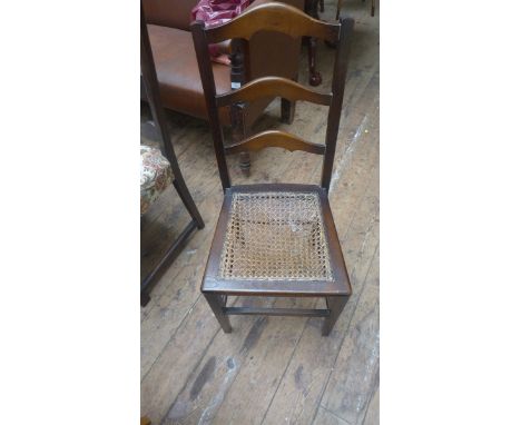 Set of 4 dark oak framed ladder chairs the padded seats upholstered in contemporary cloth together with a cane seated bedroom