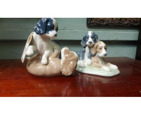 Lladro " Nao" figure of two puppies playing and another of them resting together