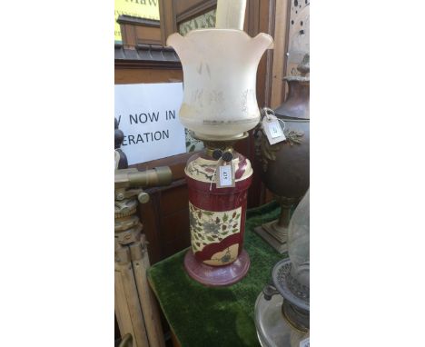 Decorative oil lamp with etched glass tinted shade, the maroon ground circular base painted birds and floral sprays