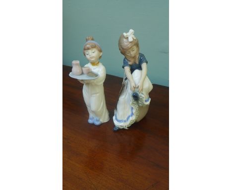 Lladro "Nao" figure of a young girl tying her shoelace and another of a younger girl carrying a breakfast tray