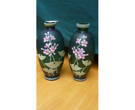 Pair of green glass urn shaped mantel piece vases each decorated pink floral sprays