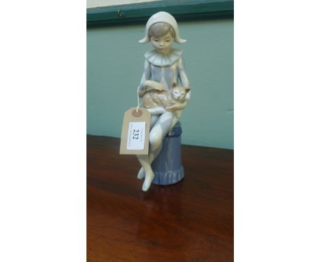 Lladro "Nao" figure of a young girl with a pixie hat playing with a cat on her lap