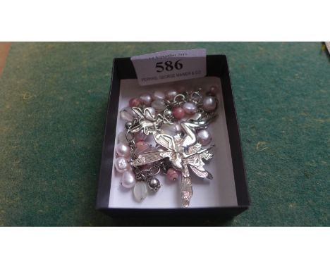 Beaded bracelet with a fairy bangle marked 925, separate fairy brooch and chain marked 925