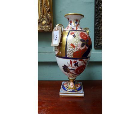 A most decorative Copeland Imari patterned handled urn shaped vase on square plinth ( 10 1/2" high)