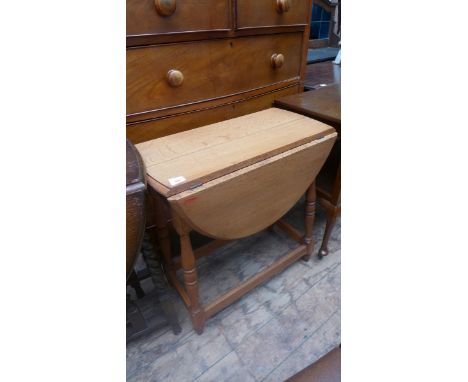 Light oak double drop leaf table