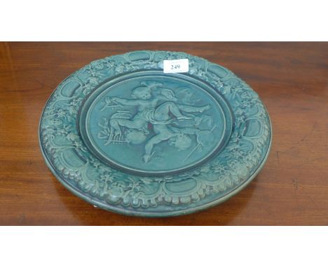 Decorative light green Majolica style circular plate, the central panel of two entwined cherubs (11 1/2" dia)