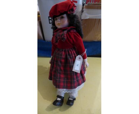 Scottish dressed doll with bisque head on stand